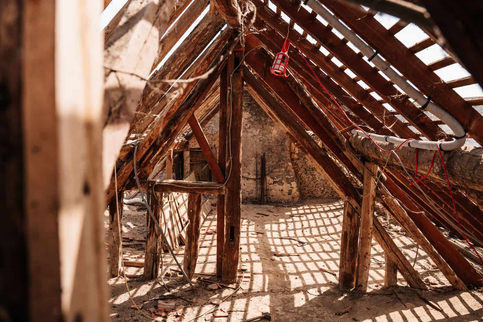 Wooden framing and rafters inside an attic space